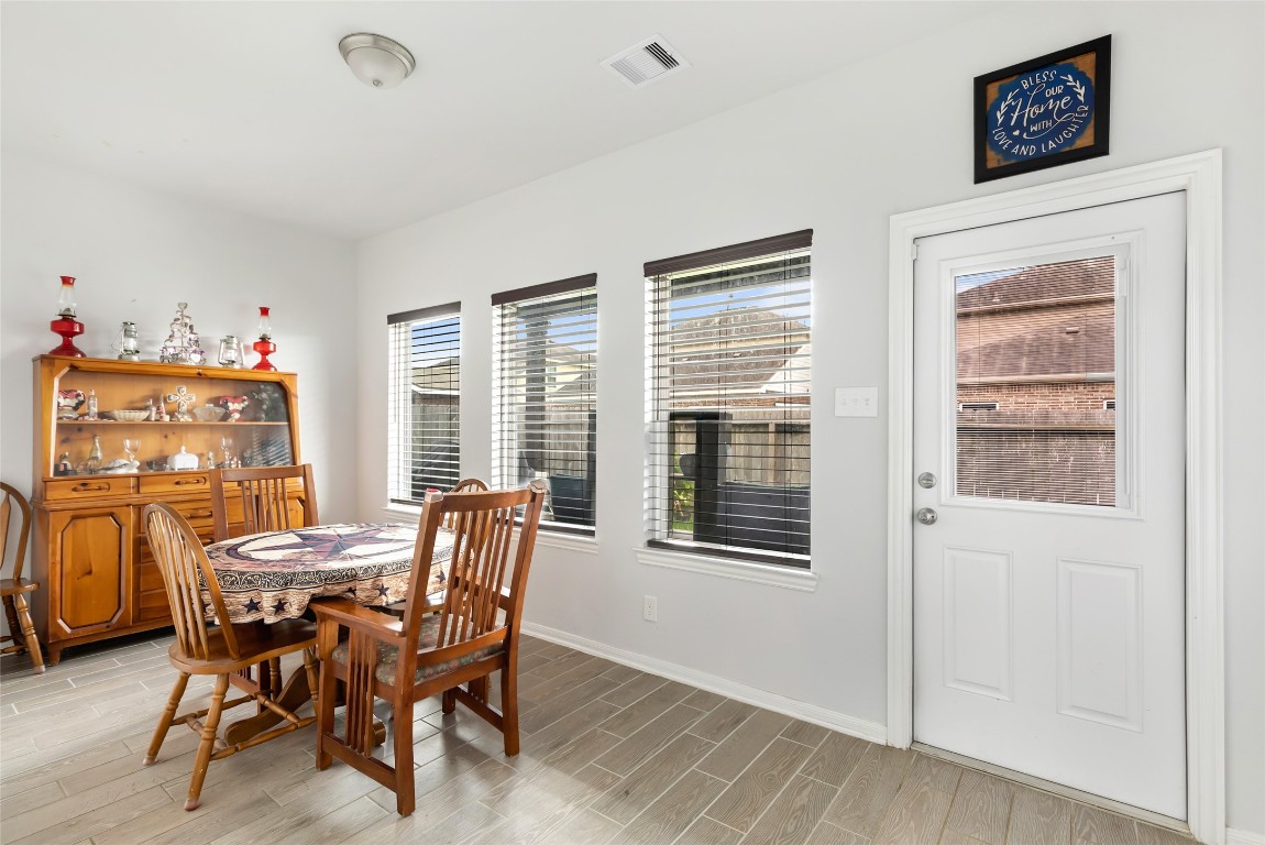 9910 Pine Forest Baytown, TX 77521 - Photo 14 of 26 a dining room with furniture and window
