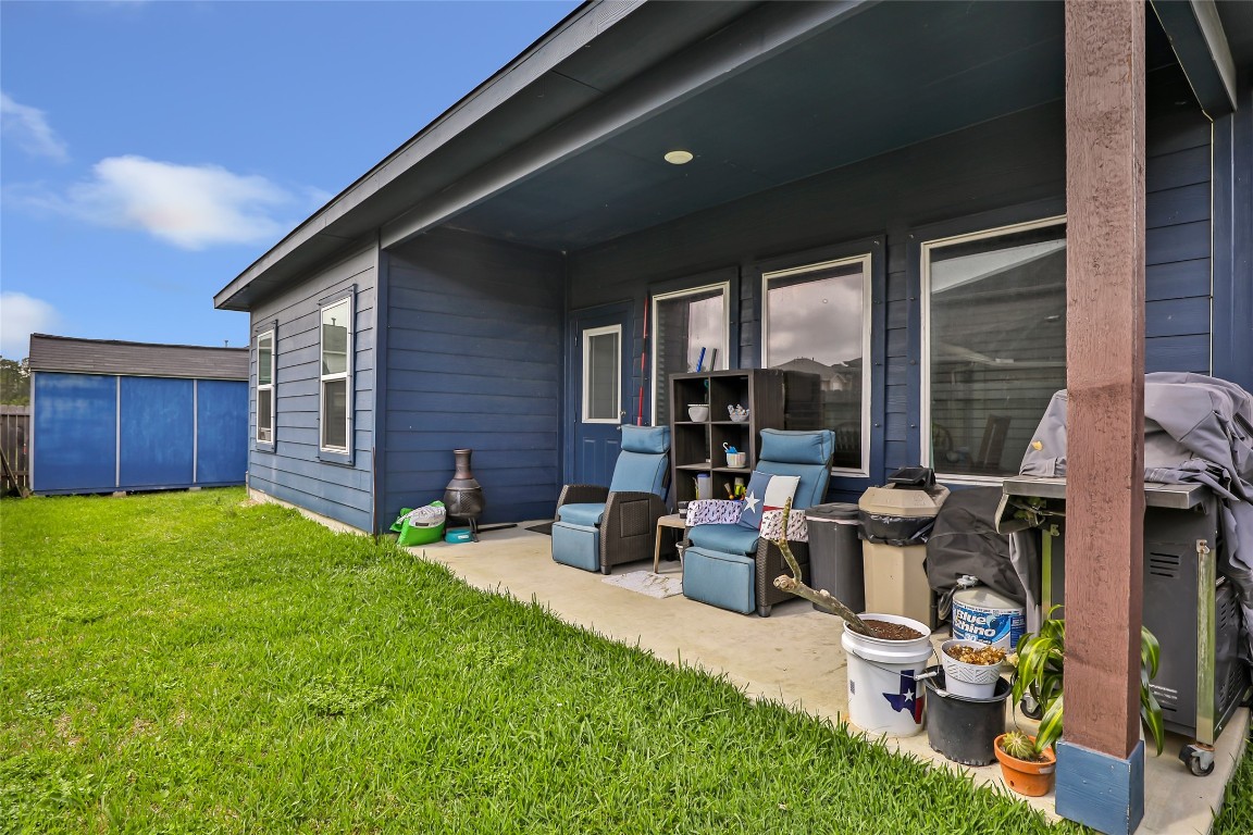 9910 Pine Forest Baytown, TX 77521 - Photo 22 of 26 a view of a house with backyard and sitting area