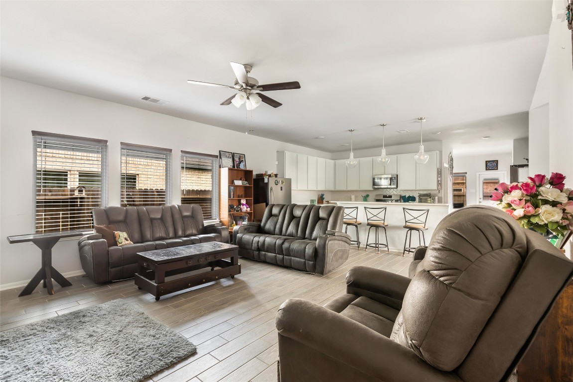 9910 Pine Forest Baytown, TX 77521 - Photo 6 of 26 a living room with furniture and a rug