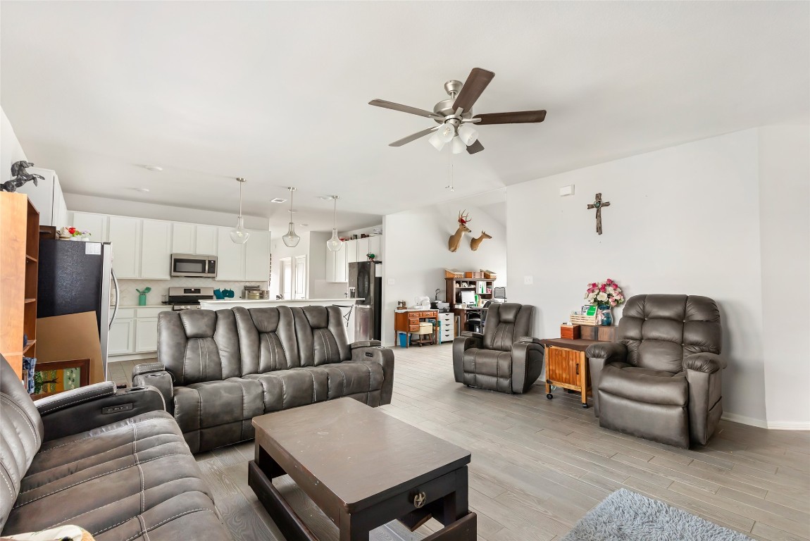 9910 Pine Forest Baytown, TX 77521 - Photo 7 of 26 a living room with furniture and a flat screen tv