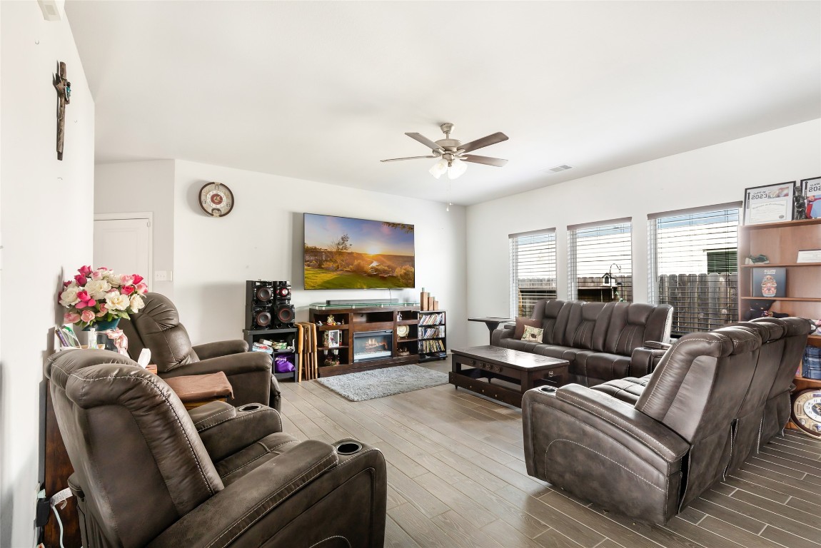 9910 Pine Forest Baytown, TX 77521 - Photo 8 of 26 a living room with furniture and a flat screen tv