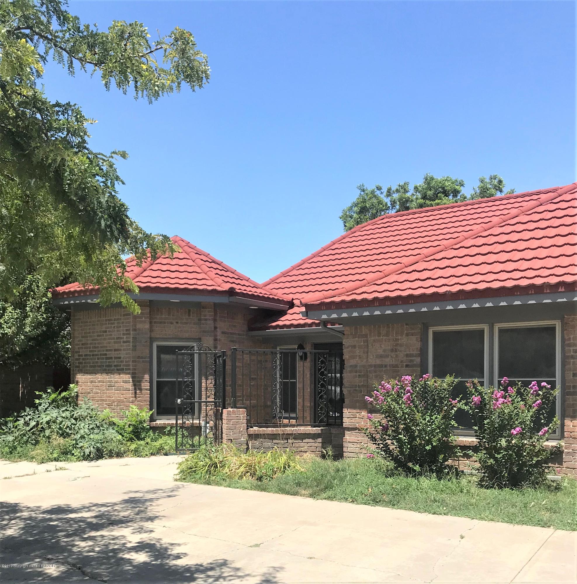 7516 Tripp Avenue Amarillo, TX 79121 - Photo 2 of 33 a front view of a house with garden