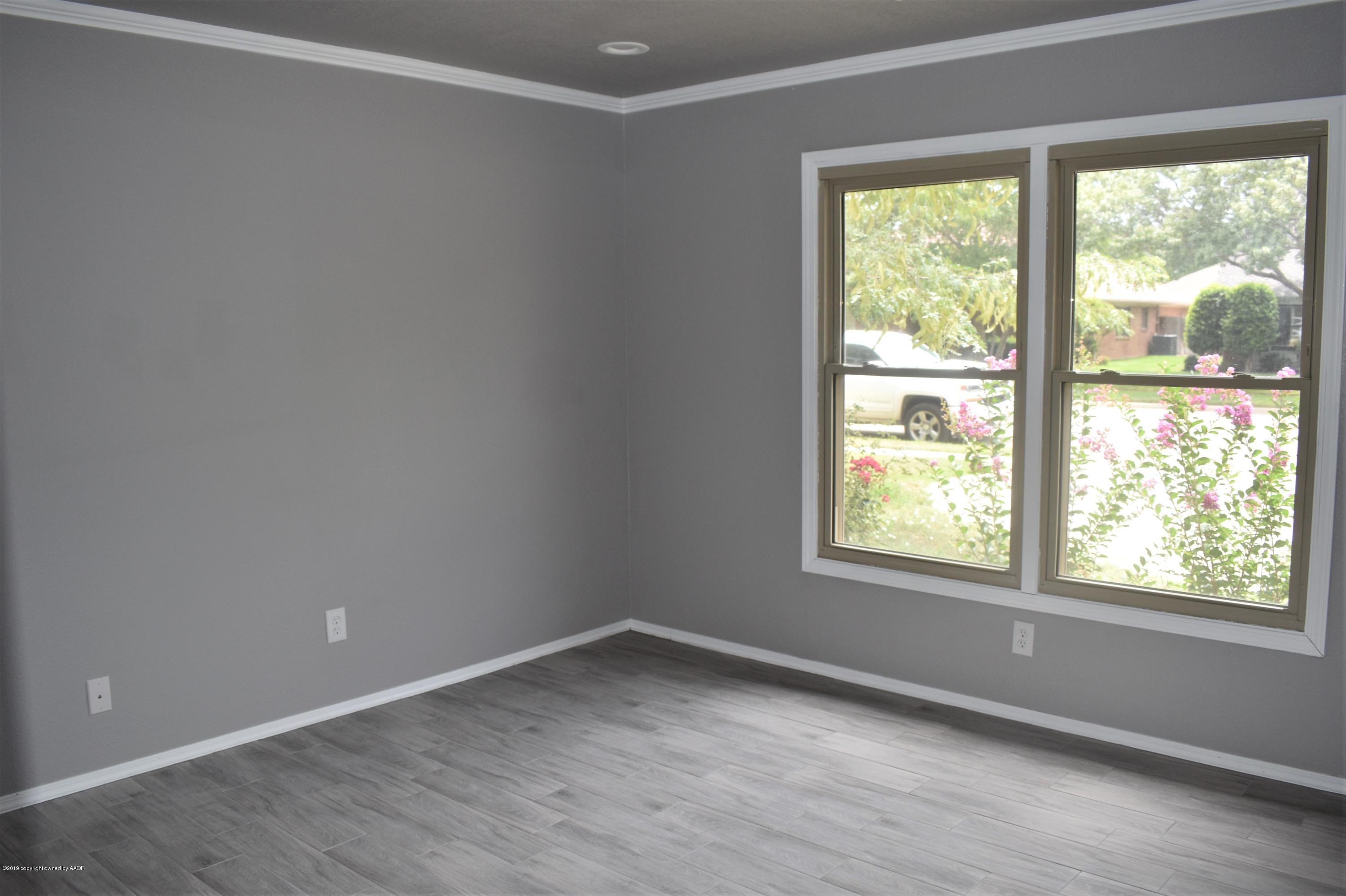 7516 Tripp Avenue Amarillo, TX 79121 - Photo 14 of 33 an empty room with a window