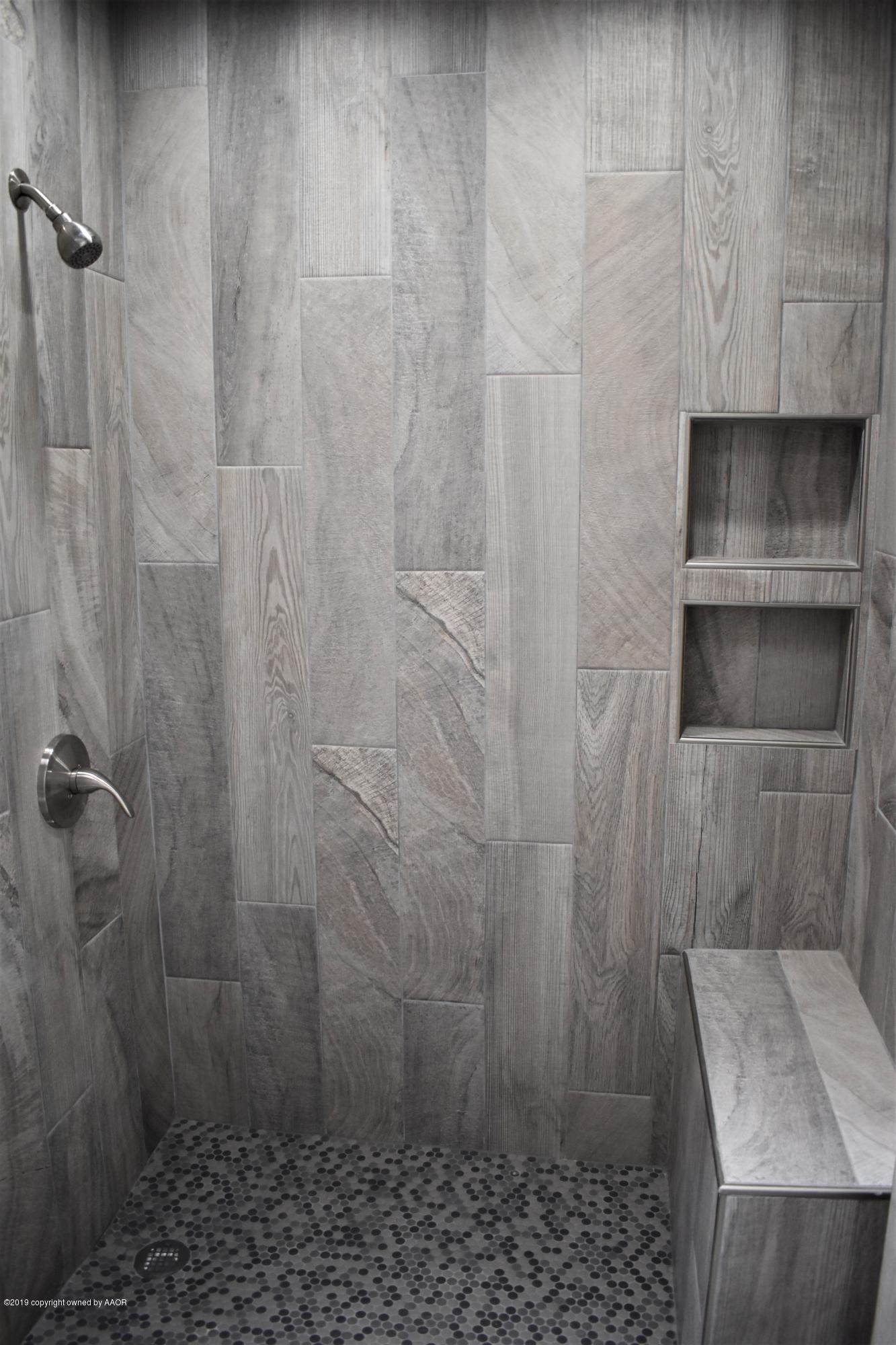 7516 Tripp Avenue Amarillo, TX 79121 - Photo 16 of 33 a bathroom with a shower