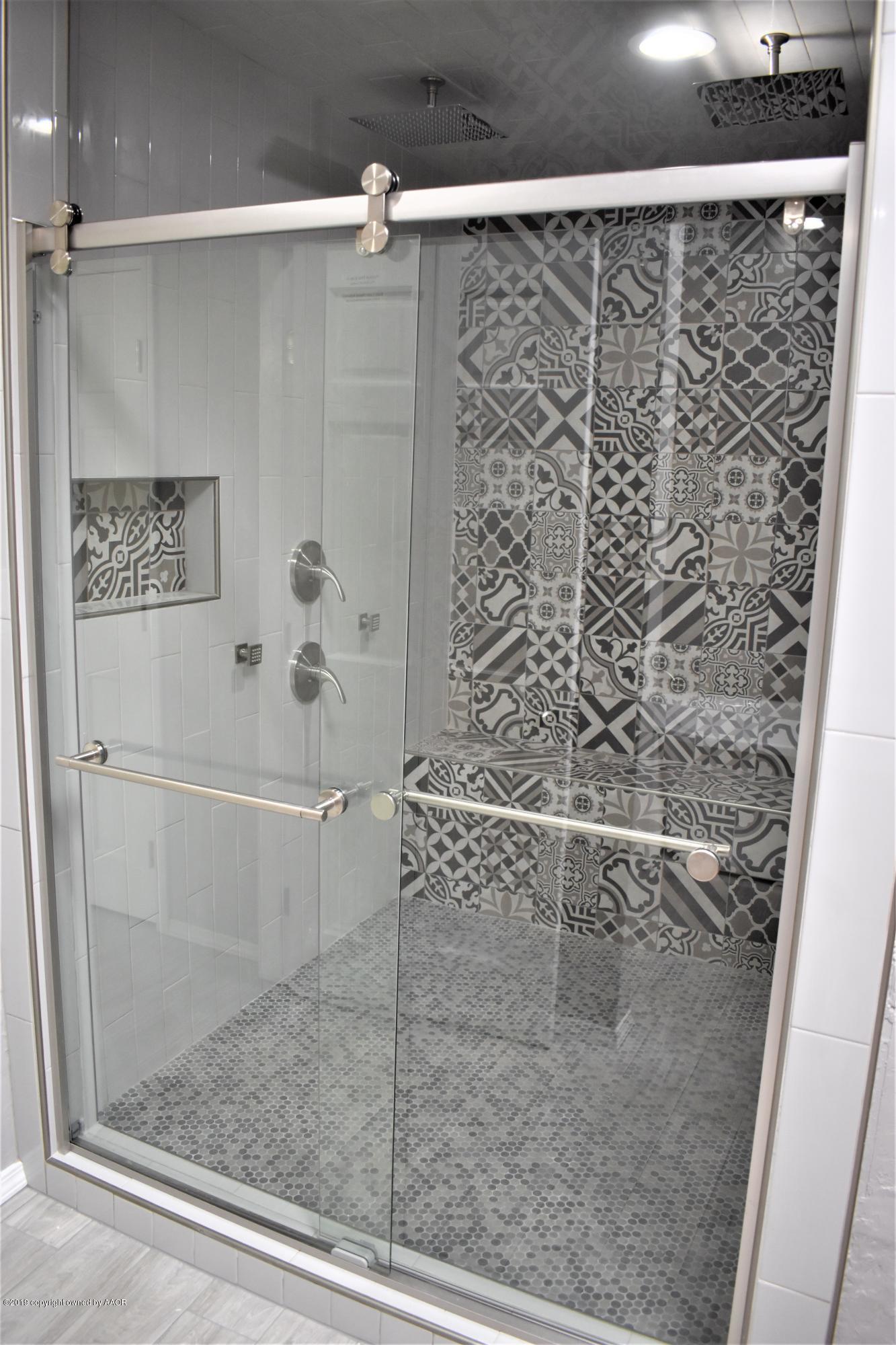 7516 Tripp Avenue Amarillo, TX 79121 - Photo 22 of 33 a bathroom with a shower