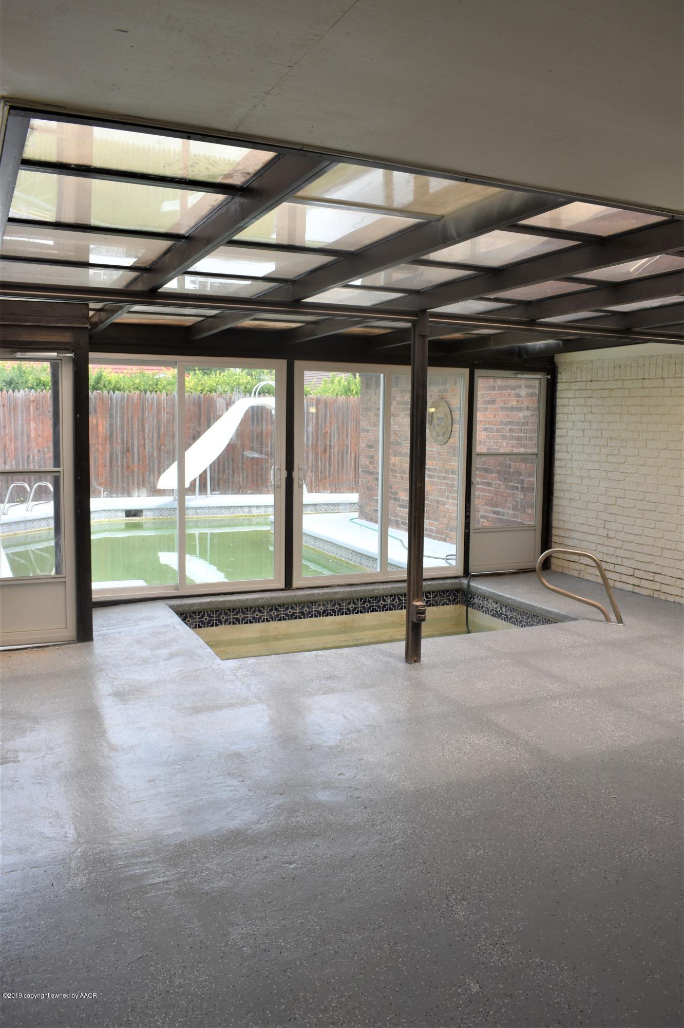 7516 Tripp Avenue Amarillo, TX 79121 - Photo 25 of 33 a view of an empty room with a sliding door