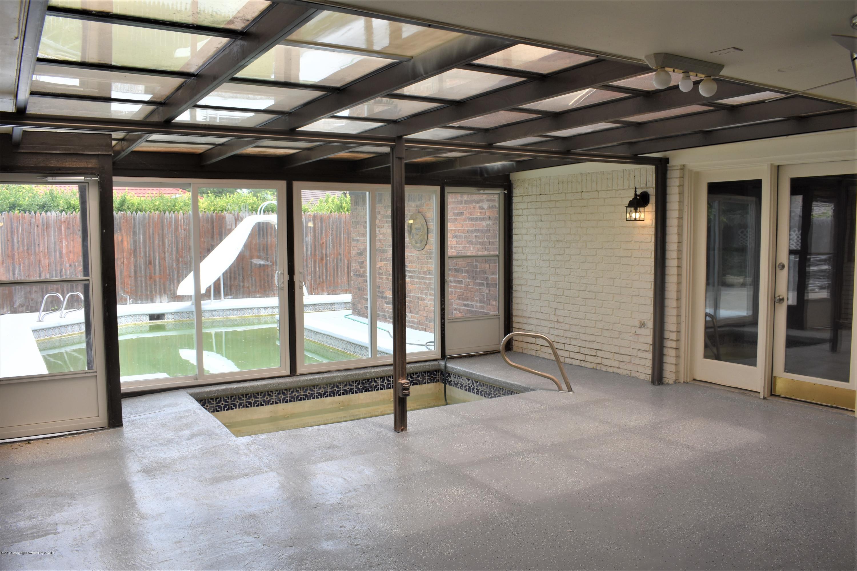 7516 Tripp Avenue Amarillo, TX 79121 - Photo 26 of 33 a view of an empty room with a sliding door
