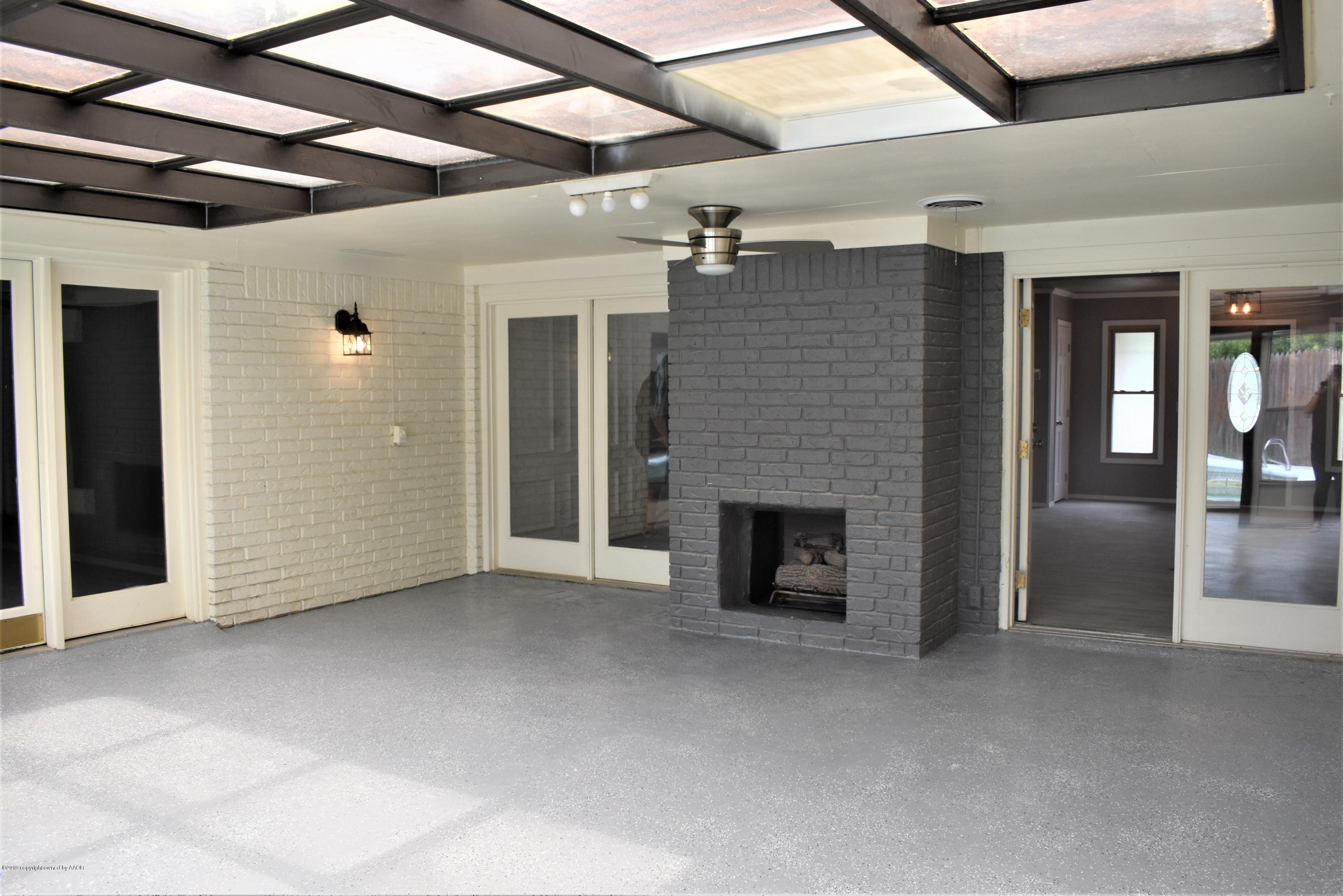 7516 Tripp Avenue Amarillo, TX 79121 - Photo 28 of 33 a view of empty room with a fireplace