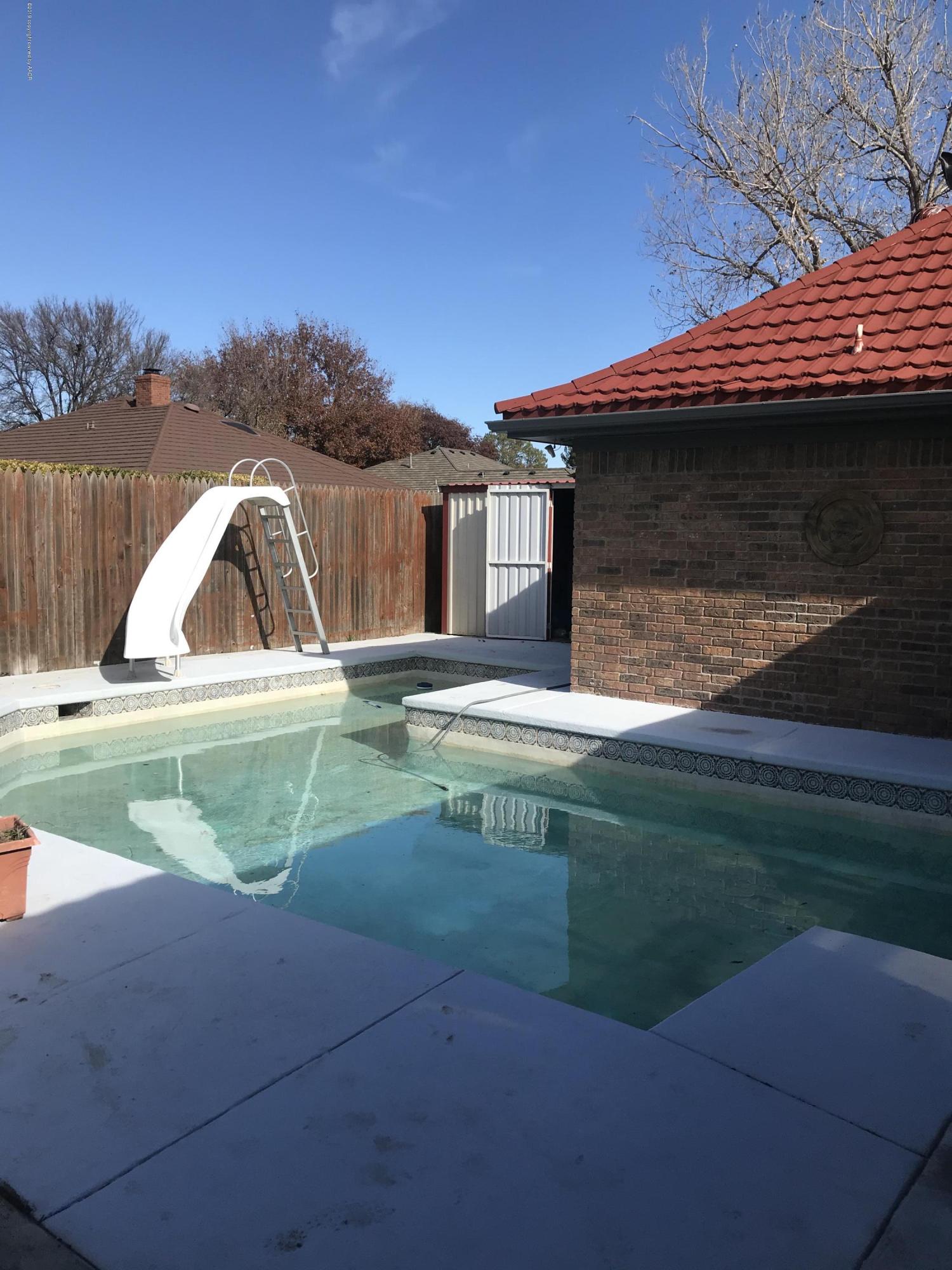 7516 Tripp Avenue Amarillo, TX 79121 - Photo 30 of 33 a view of swimming pool with a yard