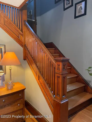 a table and chairs in front of a door