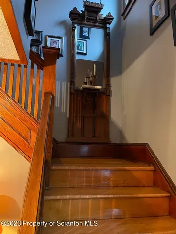 a view of living room with furniture and a potted plant