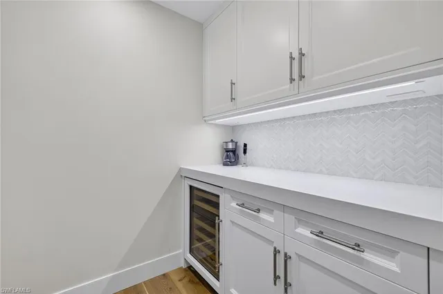 a view of storage area and utility room