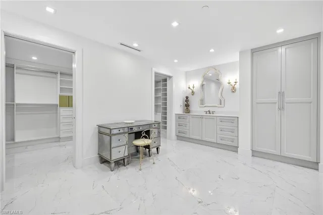 a kitchen with a sink cabinets and outdoor space