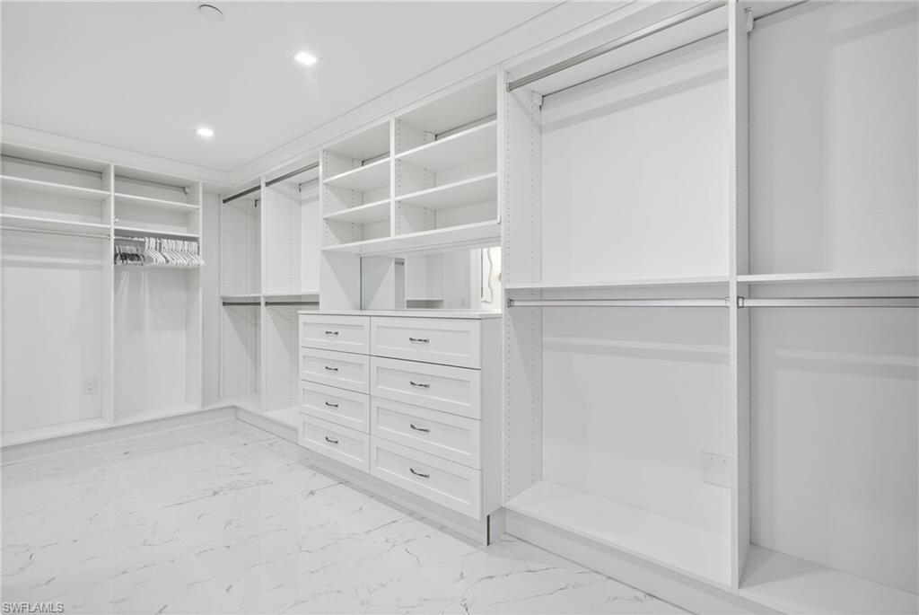 13915 Old Coast Road, Unit 1503 Naples, FL 34110 - Photo 18 of 49 a view of an empty walk in closet