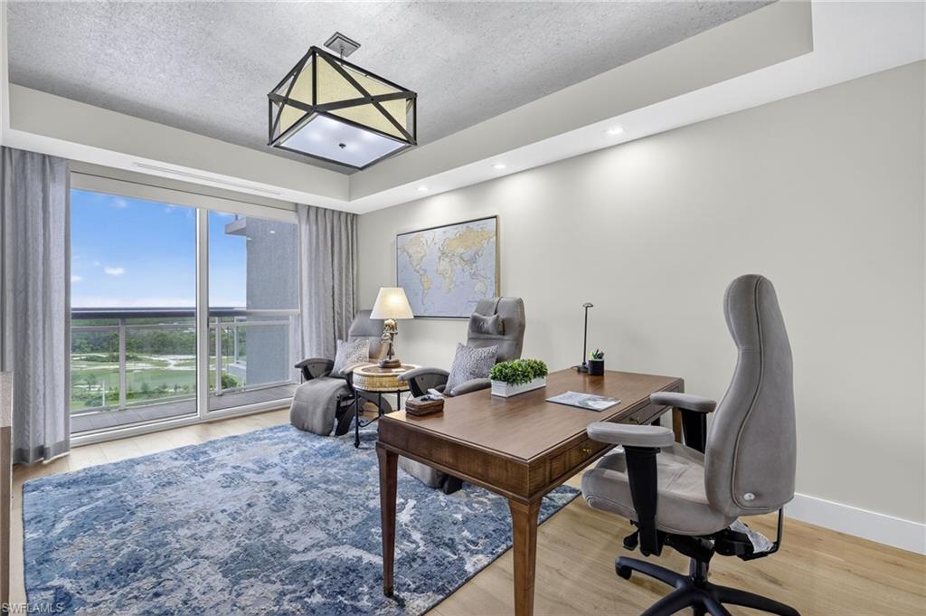 13915 Old Coast Road, Unit 1503 Naples, FL 34110 - Photo 23 of 49 a living room with furniture