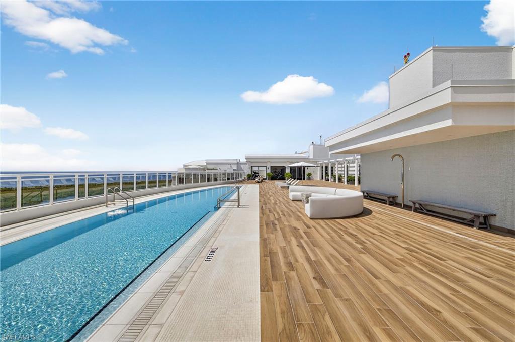13915 Old Coast Road, Unit 1503 Naples, FL 34110 - Photo 32 of 49 a view of a swimming pool and a yard