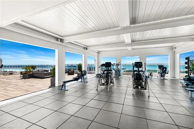 a lobby with furniture and outdoor view