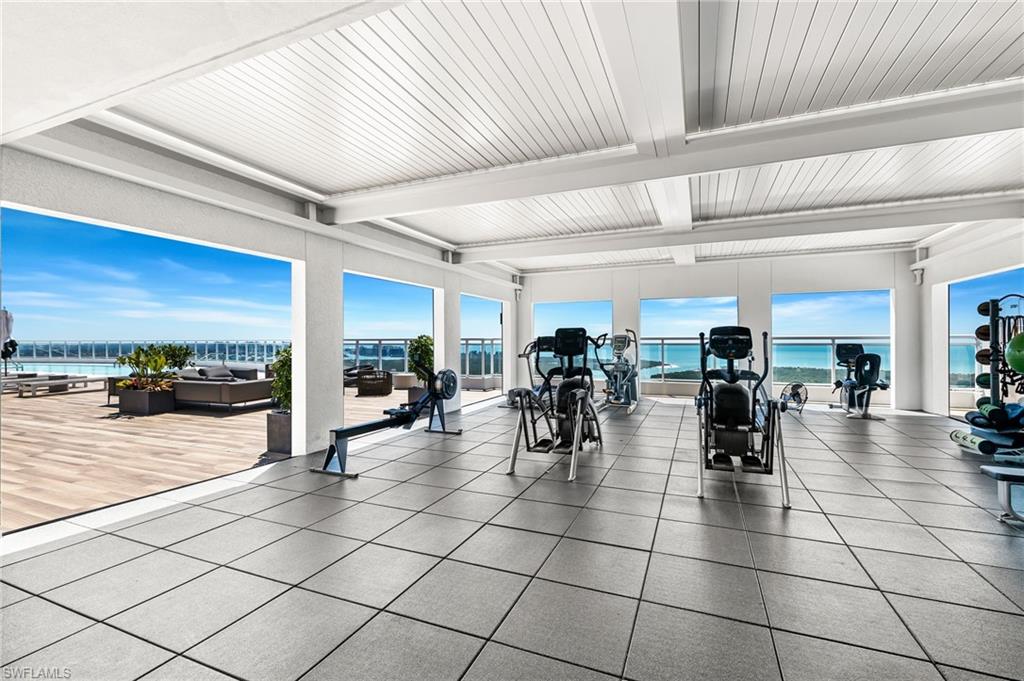 13915 Old Coast Road, Unit 1503 Naples, FL 34110 - Photo 38 of 49 a lobby with furniture and outdoor view