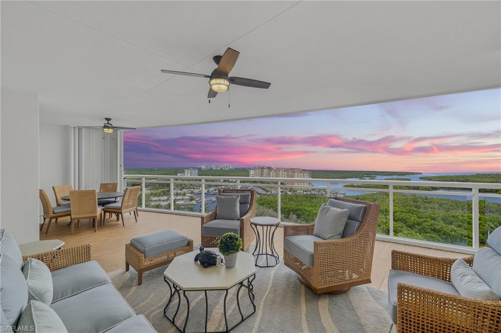 13915 Old Coast Road, Unit 1503 Naples, FL 34110 - Photo 42 of 49 a outdoor space with patio the couches and dining table with garden view