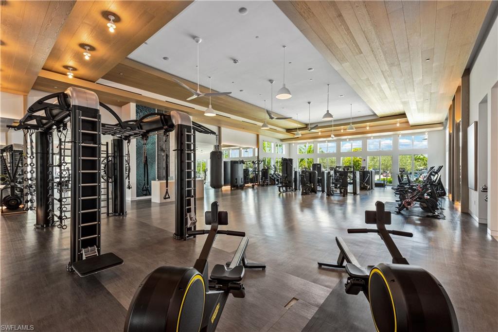 13915 Old Coast Road, Unit 1503 Naples, FL 34110 - Photo 43 of 49 a room with gym equipment and a large window