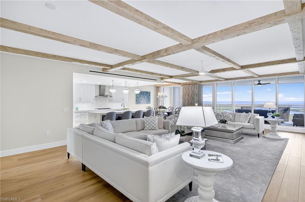 13915 Old Coast Road, Unit 1503 Naples, FL 34110 - Photo 7 of 49 a living room with furniture and wooden floor