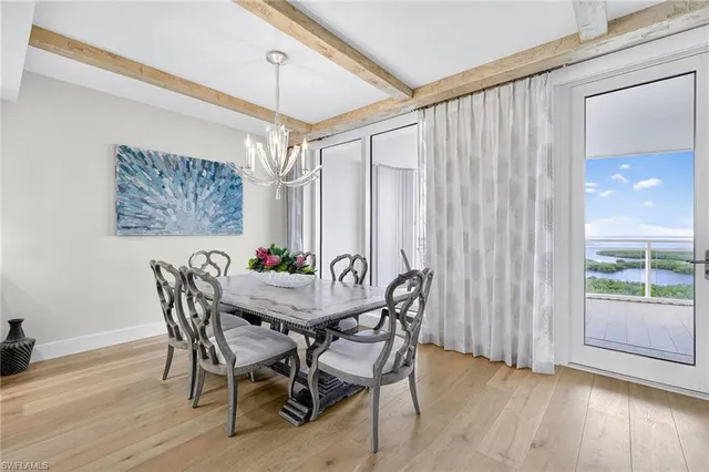 a view of a dining room with furniture and window