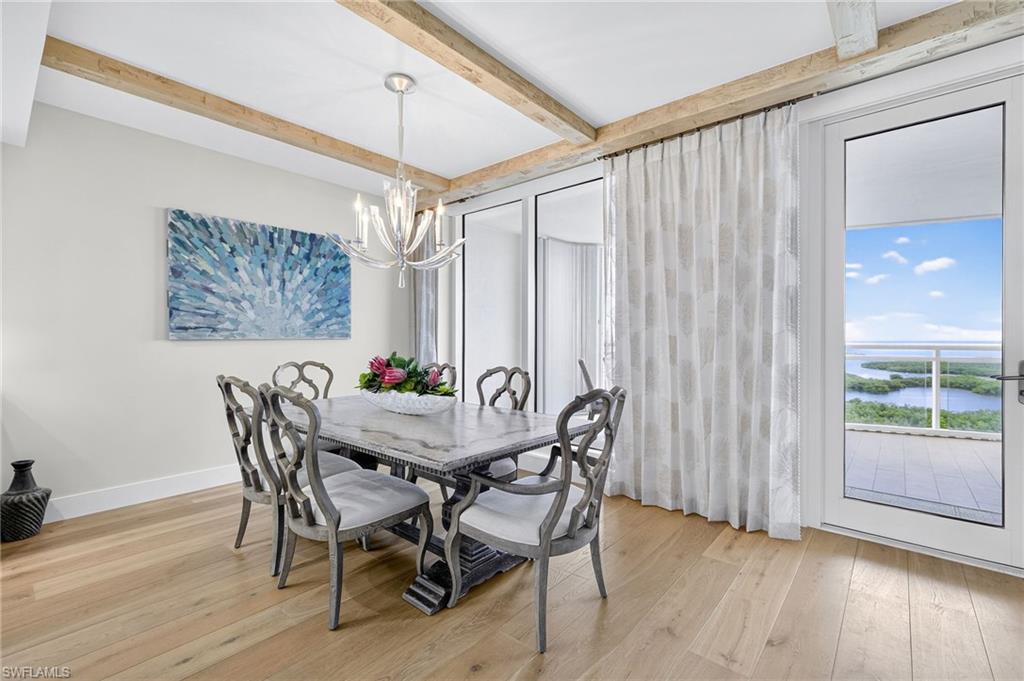 13915 Old Coast Road, Unit 1503 Naples, FL 34110 - Photo 8 of 49 a view of a dining room with furniture and window
