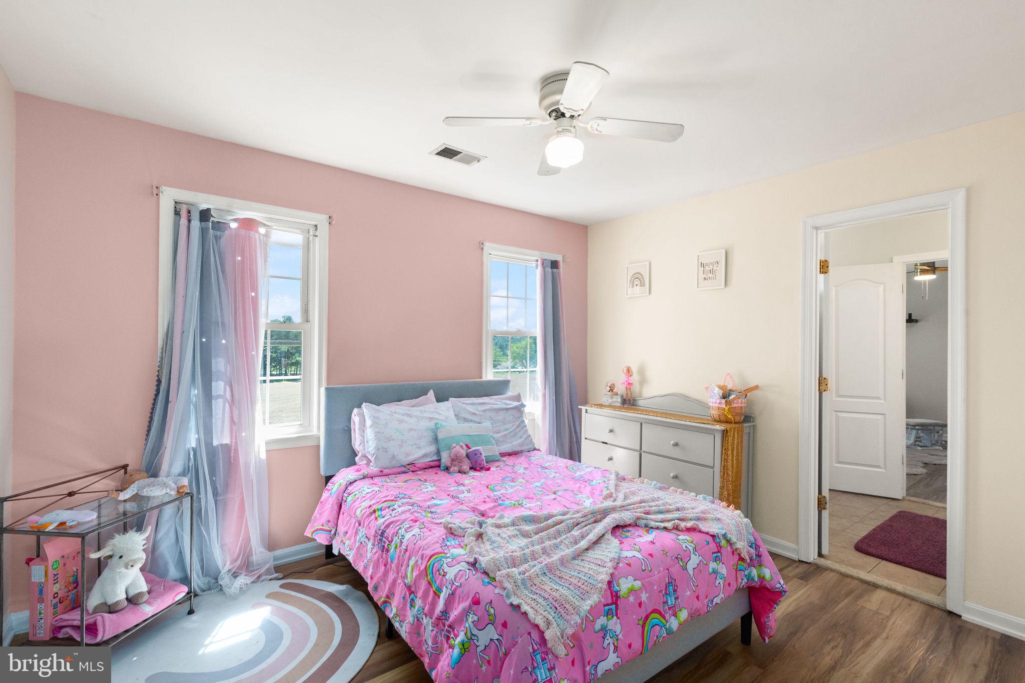 2140 Marston Road New Windsor, MD 21776 - Photo 31 of 48 a bedroom with a bed and wooden floor