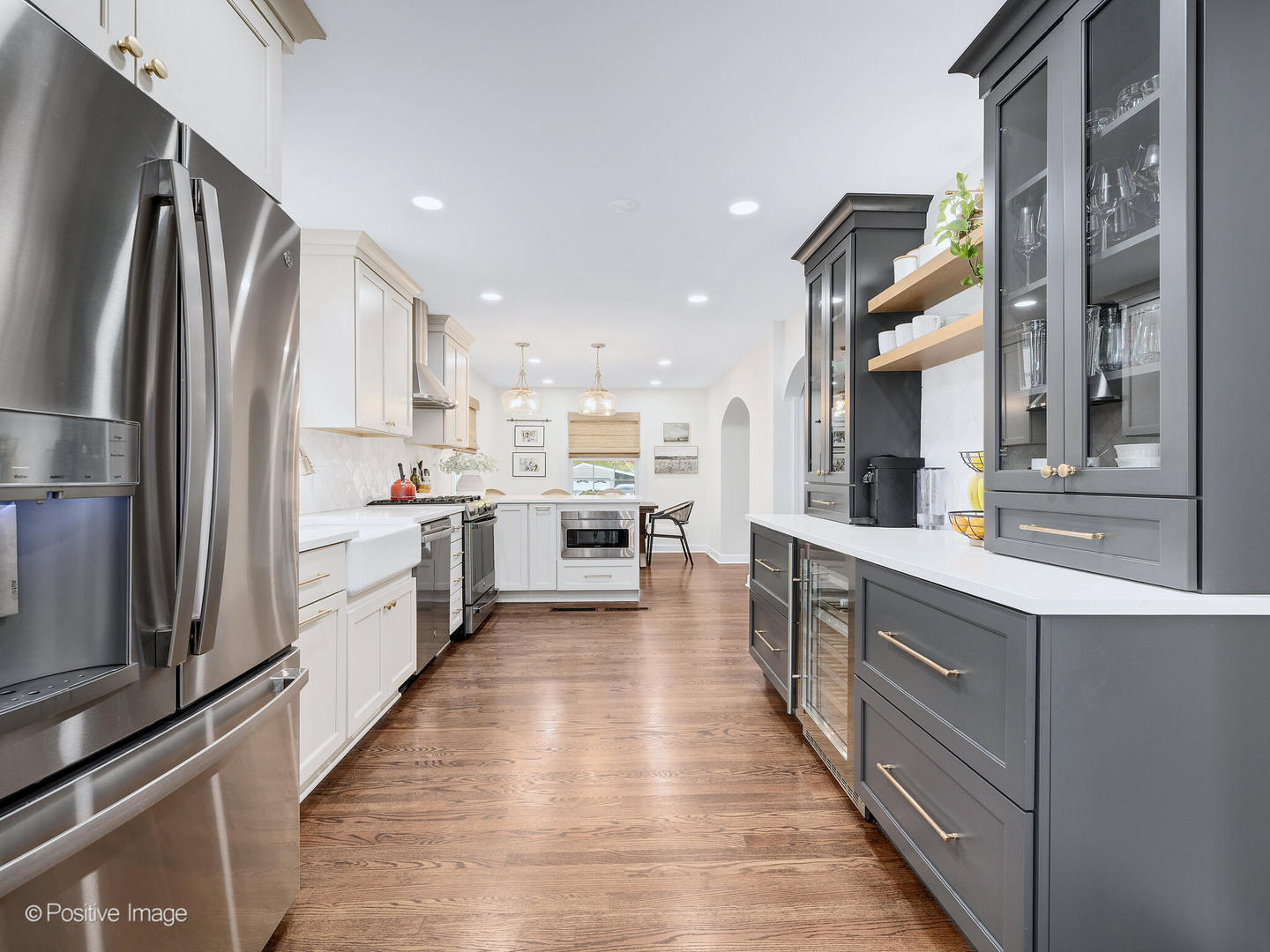 637 South Prospect Avenue Elmhurst, IL 60126 - Photo 14 of 37 a large kitchen with stainless steel appliances kitchen island a large counter top and a refrigerator