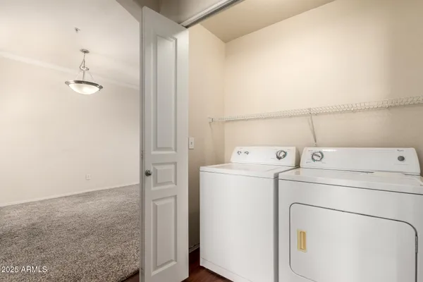 a balcony with furniture and a potted plant