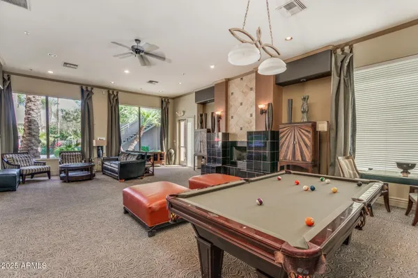 a bedroom with furniture and a flat screen tv