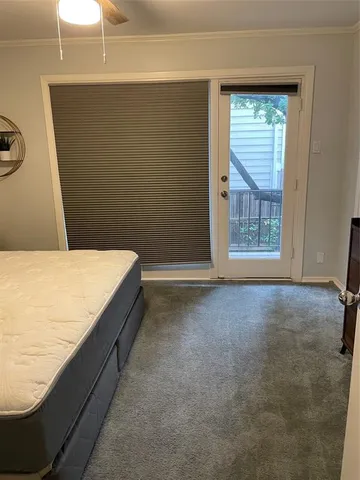 a room with a bed and a window