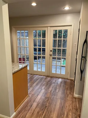 a view of a house with wooden floor and a window