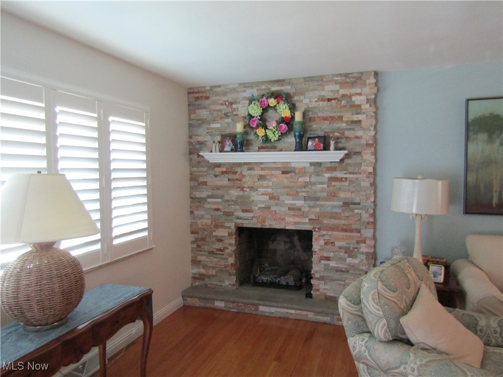 2970 Culler Road Weirton, WV 26062 - Photo 6 of 34 Living room with hardwood / wood-style flooring and a stone fireplace