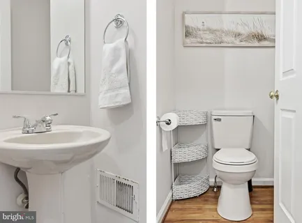 a bathroom with a sink toilet and a mirror
