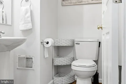 a bathroom with a toilet and a sink