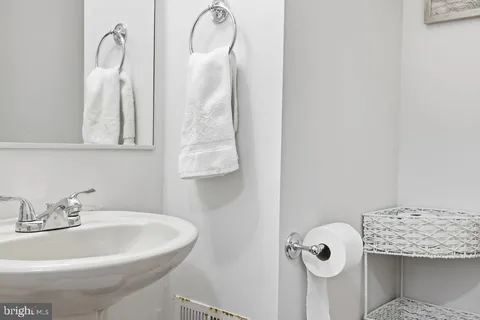 a bathroom with a sink and mirror