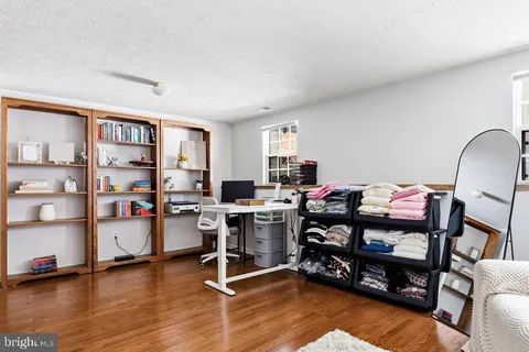 a view of a workspace with furniture and toys