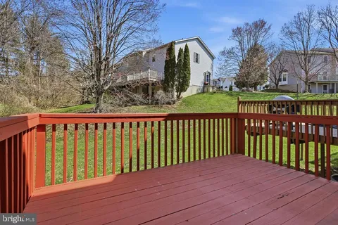 a balcony with wooden floor