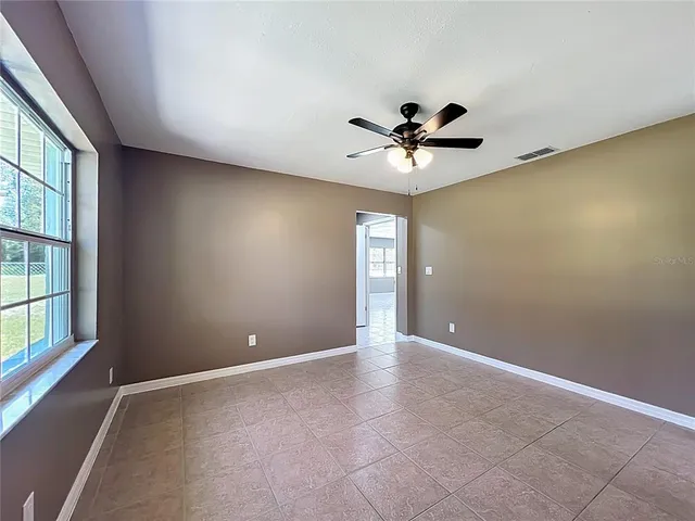 a view of an empty room with a window