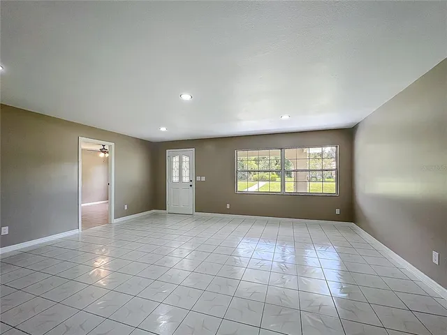 a view of an empty room and window