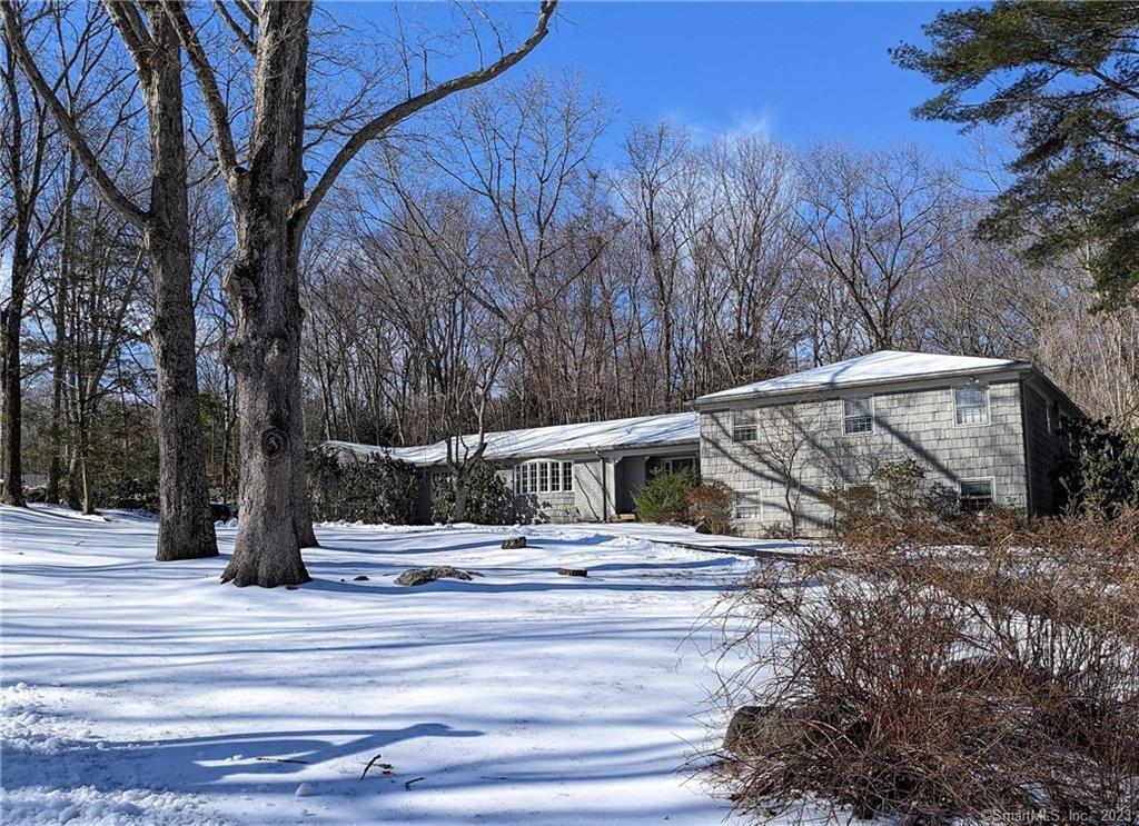 16 Pine Ridge Road Woodbridge, CT 06525 - Photo 1 of 1 a view of a swimming pool with a patio