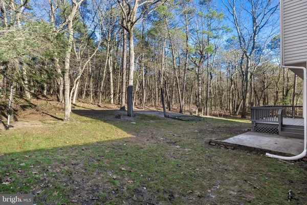 a view of outdoor space with deck and yard