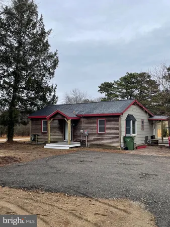 a kitchen with stainless steel appliances kitchen island granite countertop a stove a sink and a refrigerator