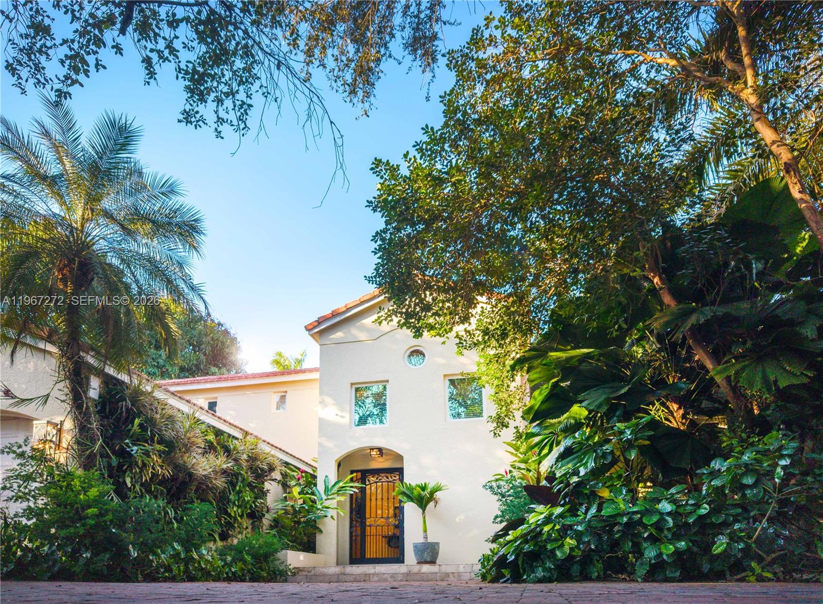4867 Southwest 82nd Street Miami, FL 33143 - Photo 12 of 69 a front view of a house with a tree