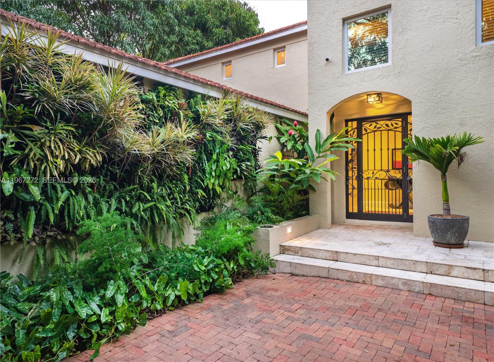 4867 Southwest 82nd Street Miami, FL 33143 - Photo 13 of 69 a front view of a house with garden