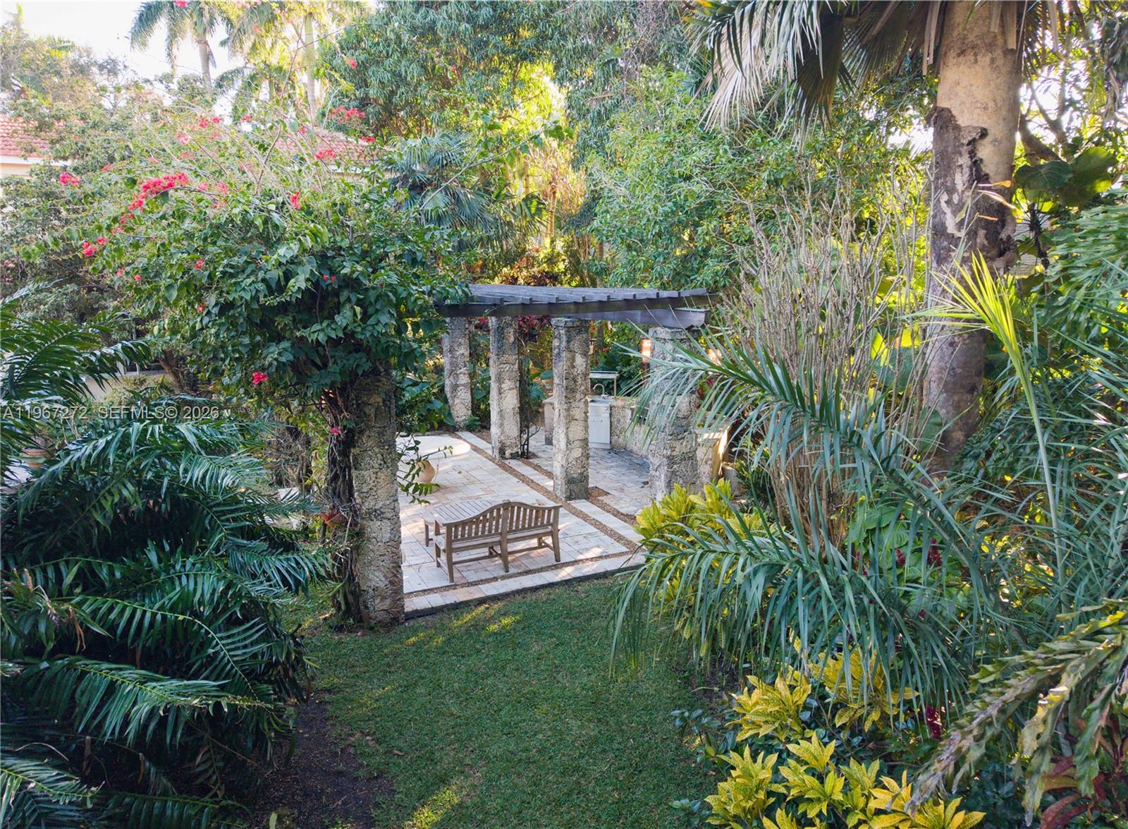 4867 Southwest 82nd Street Miami, FL 33143 - Photo 14 of 69 a view of a house with a backyard and sitting area