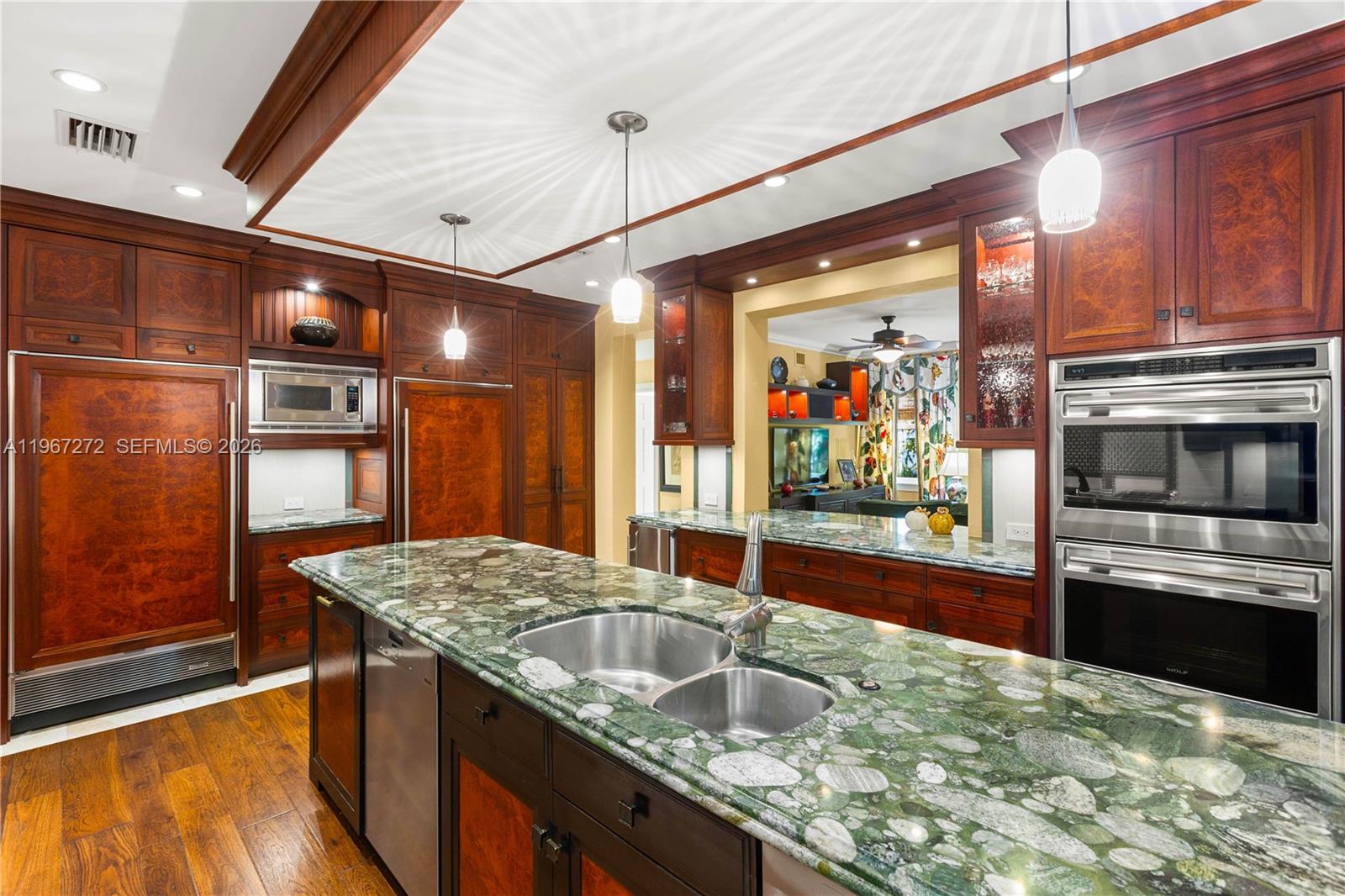 4867 Southwest 82nd Street Miami, FL 33143 - Photo 30 of 69 a kitchen with stainless steel appliances granite countertop a sink and cabinets