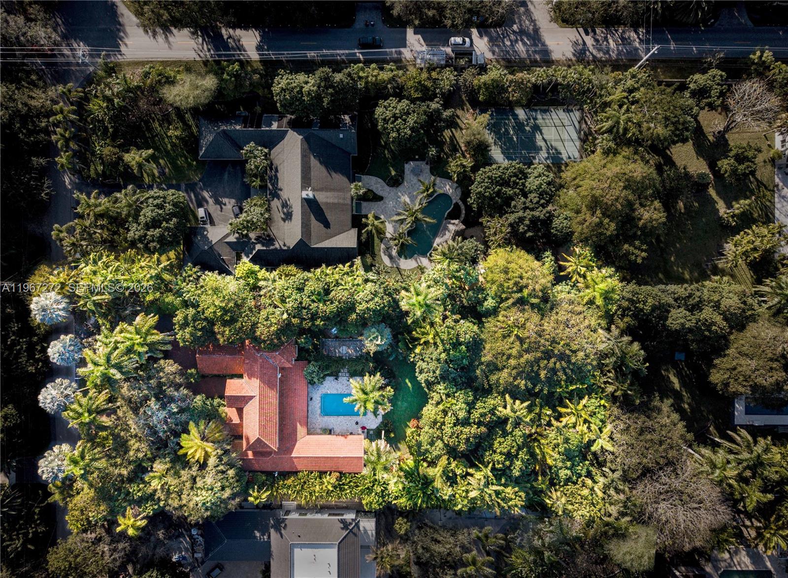 4867 Southwest 82nd Street Miami, FL 33143 - Photo 3 of 69 an aerial view of a house with a yard and lake view