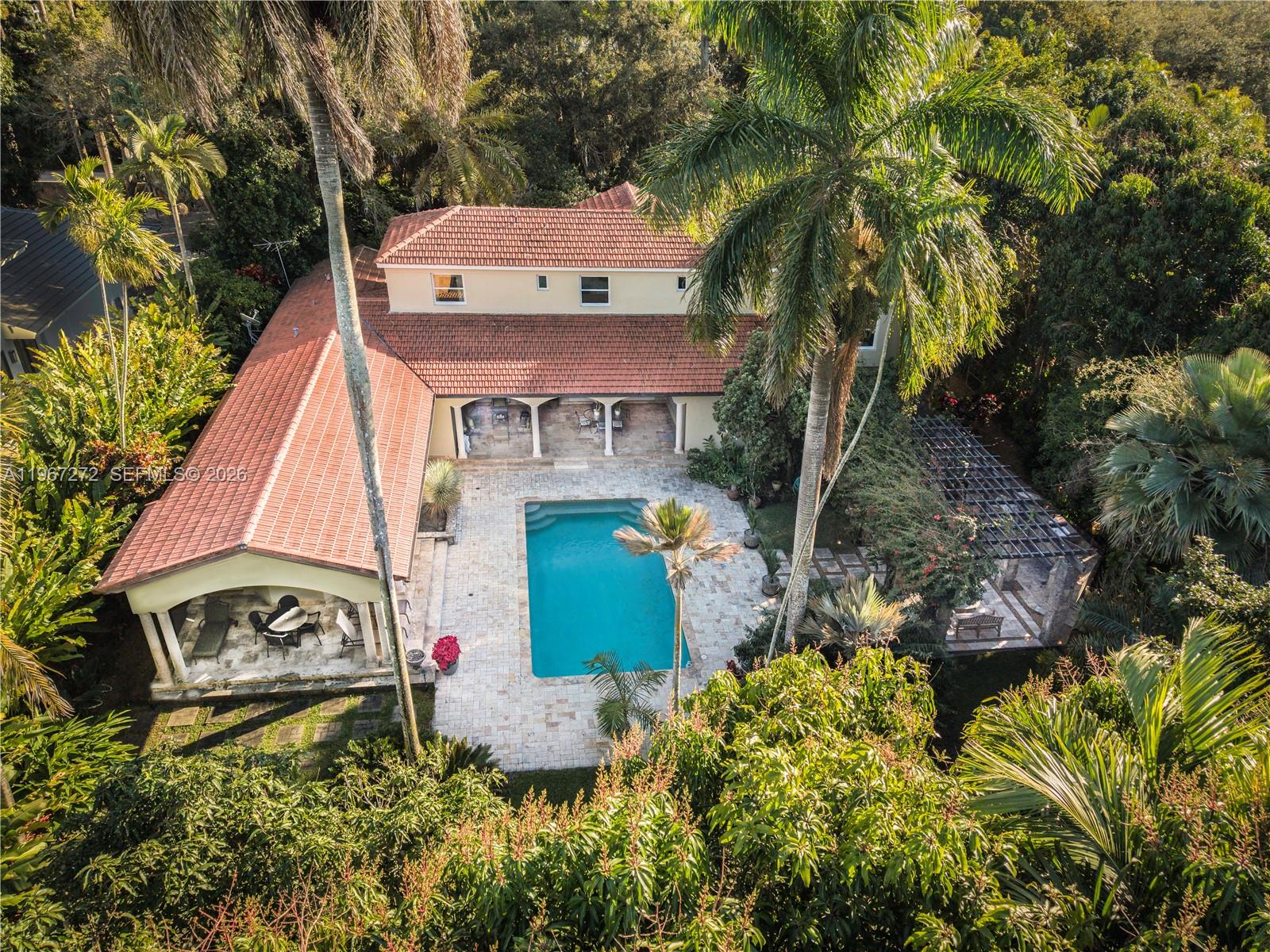 4867 Southwest 82nd Street Miami, FL 33143 - Photo 4 of 69 an aerial view of a house with a yard and garden